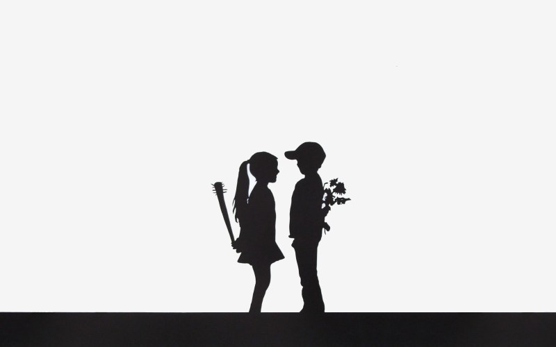 The silhouette of a boy and a girl