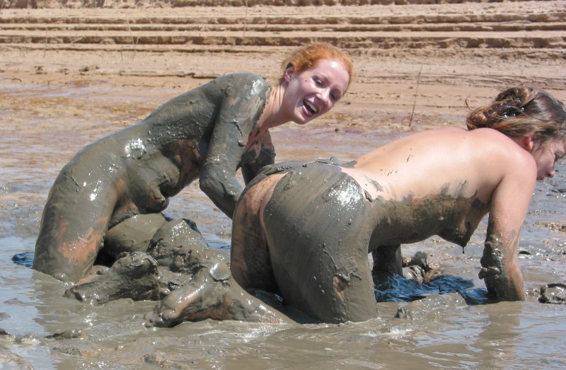 Naked beauties in mud
