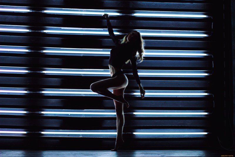 Girl dances in the dark