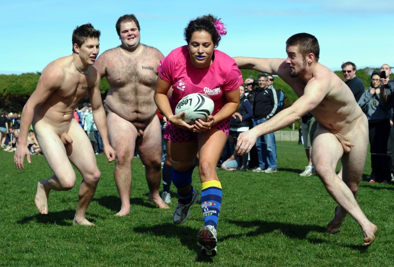 Naked football players on the field