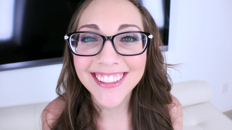 Cumshot on the face of a girl with glasses