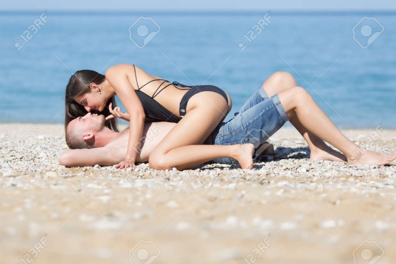 Girls on the beach kiss