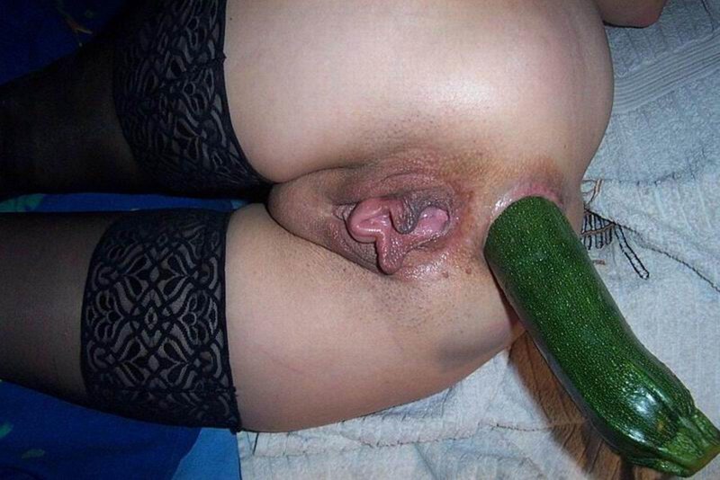 Girl with cucumber in vagina