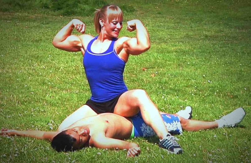 Muscular woman against