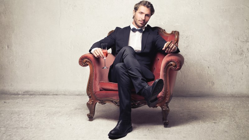 A man in a suit is sitting