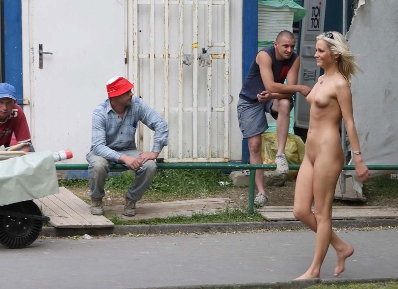 Naked woman among dressed