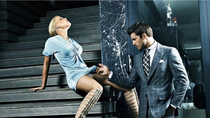 The man looks under the dress