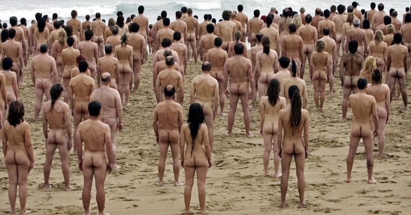 A crowd of naked women on the beach