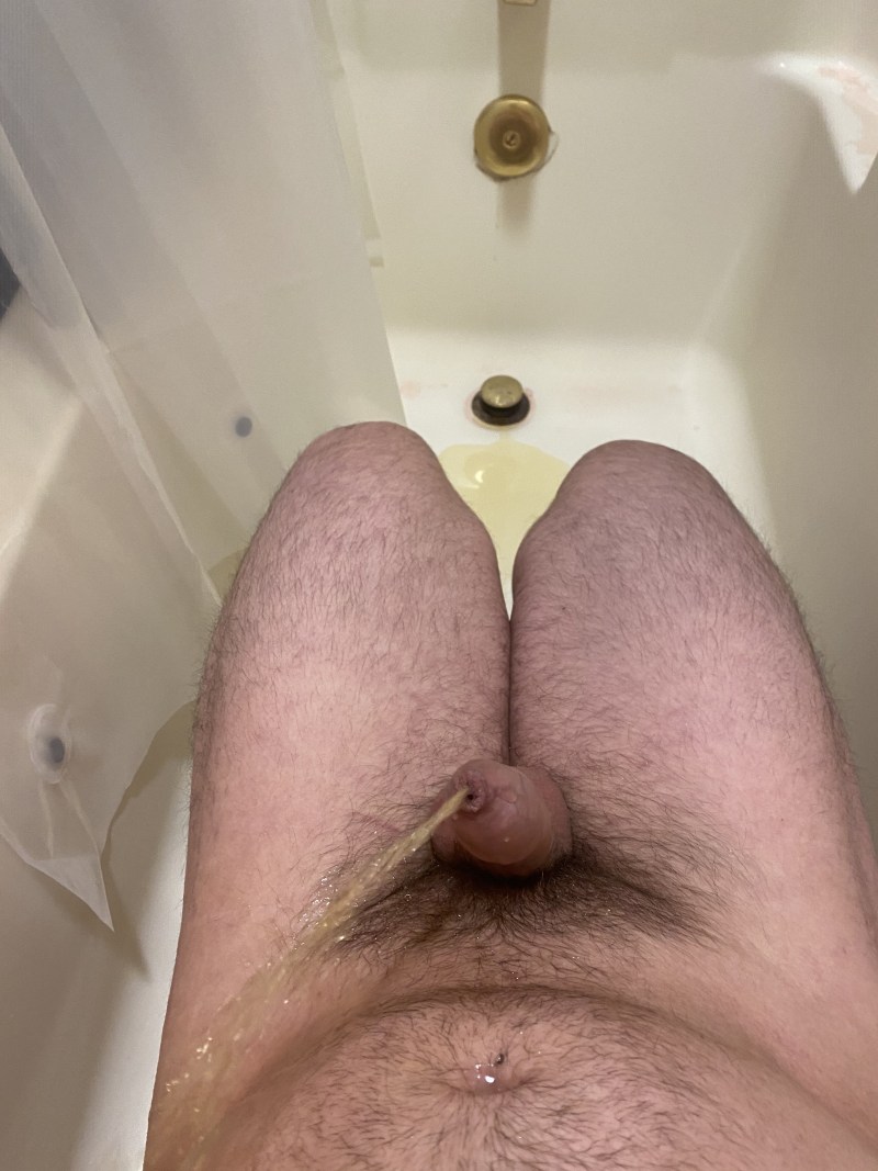 Girl pissing a guy's penis