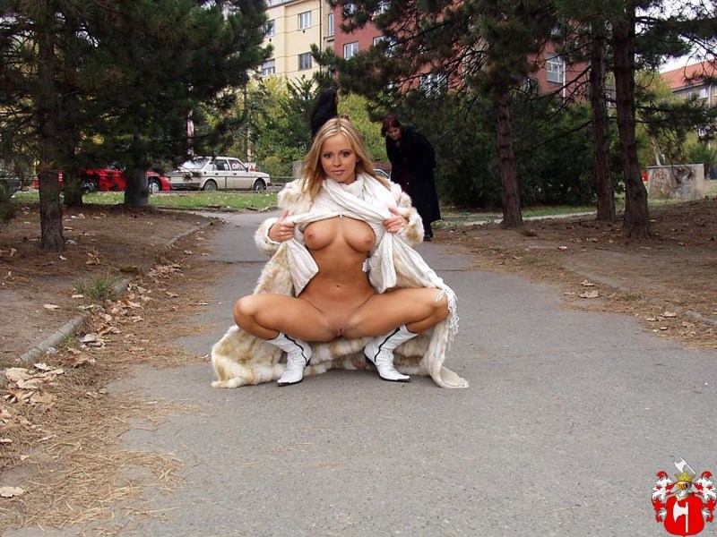 Woman undresses on the street