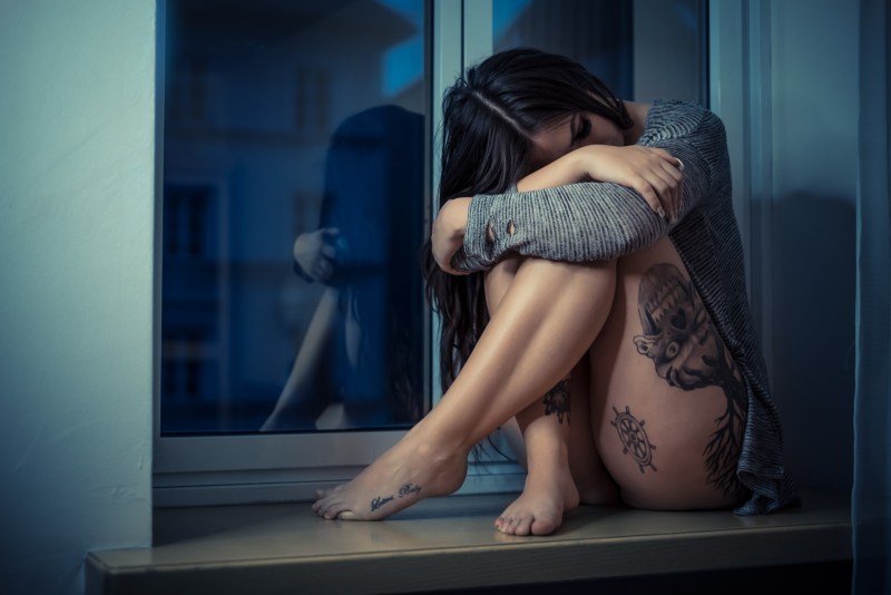 Brunette on the windowsill