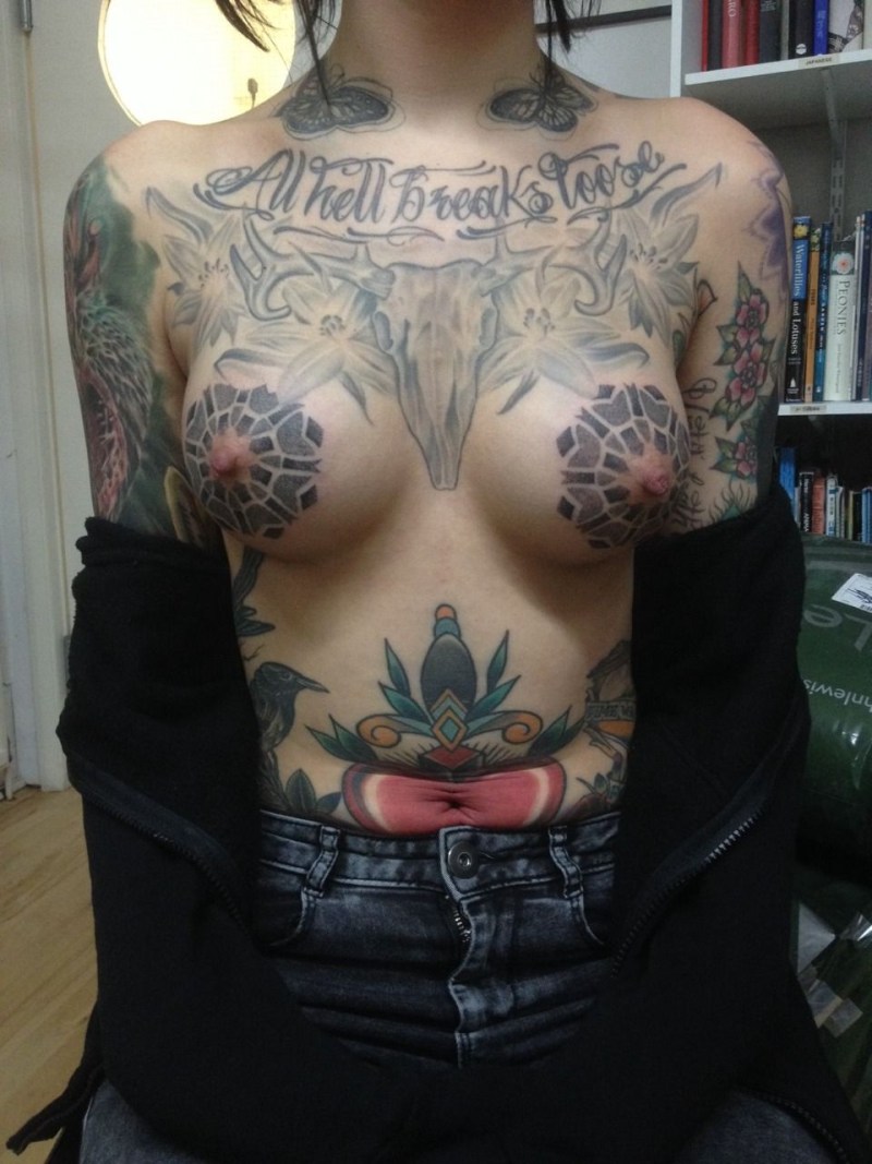 Tattoo on naked female breast