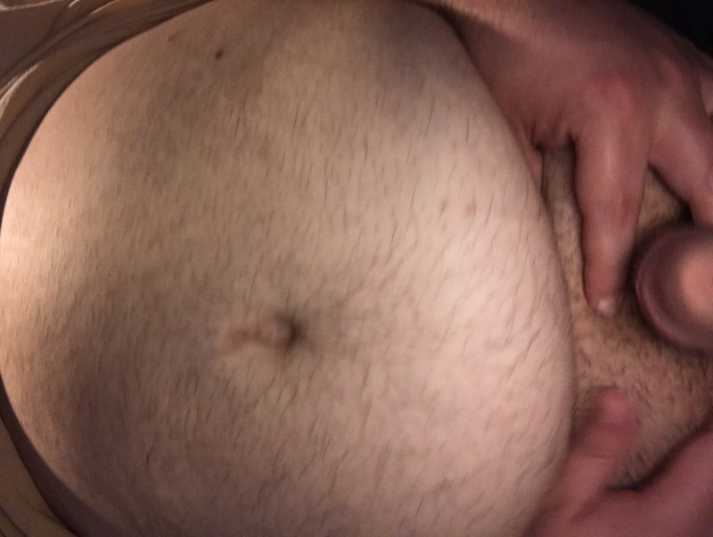 Naked pregnant woman with piercing