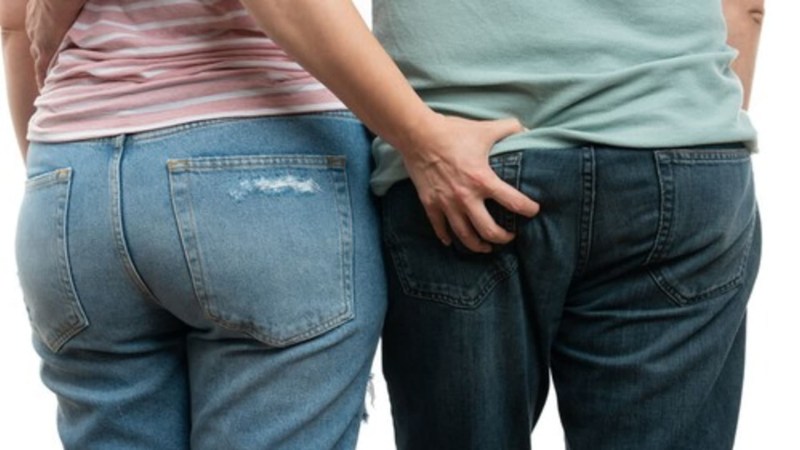 A woman in jeans bent down