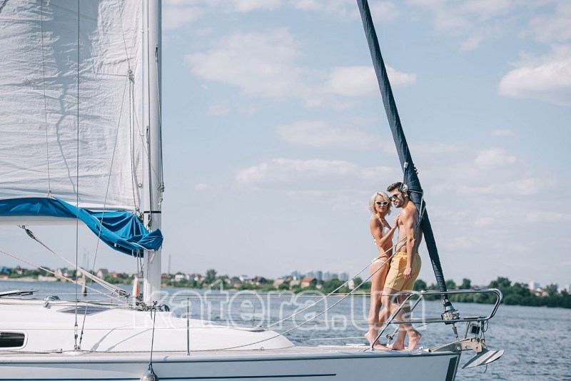 Young couple is resting on a yacht