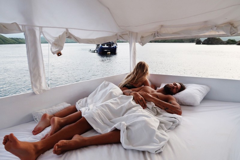 A guy with a girl at sea