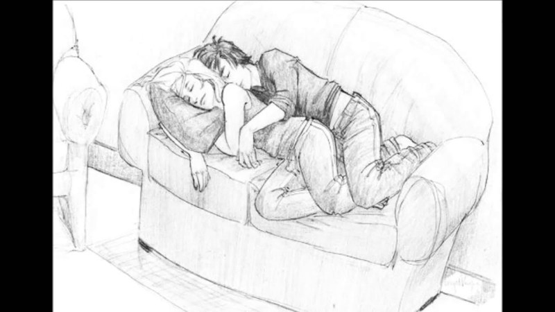 Girl on the couch drawing with a pencil