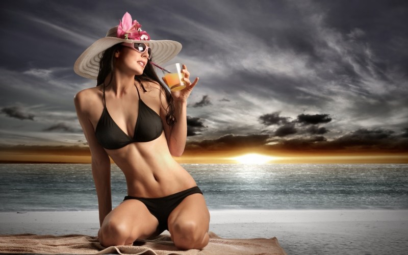 Mom on the beach in a swimsuit