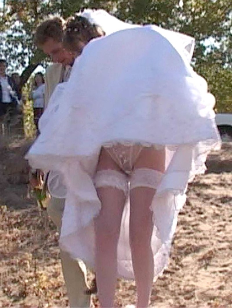 Peeping under the dress of the bride