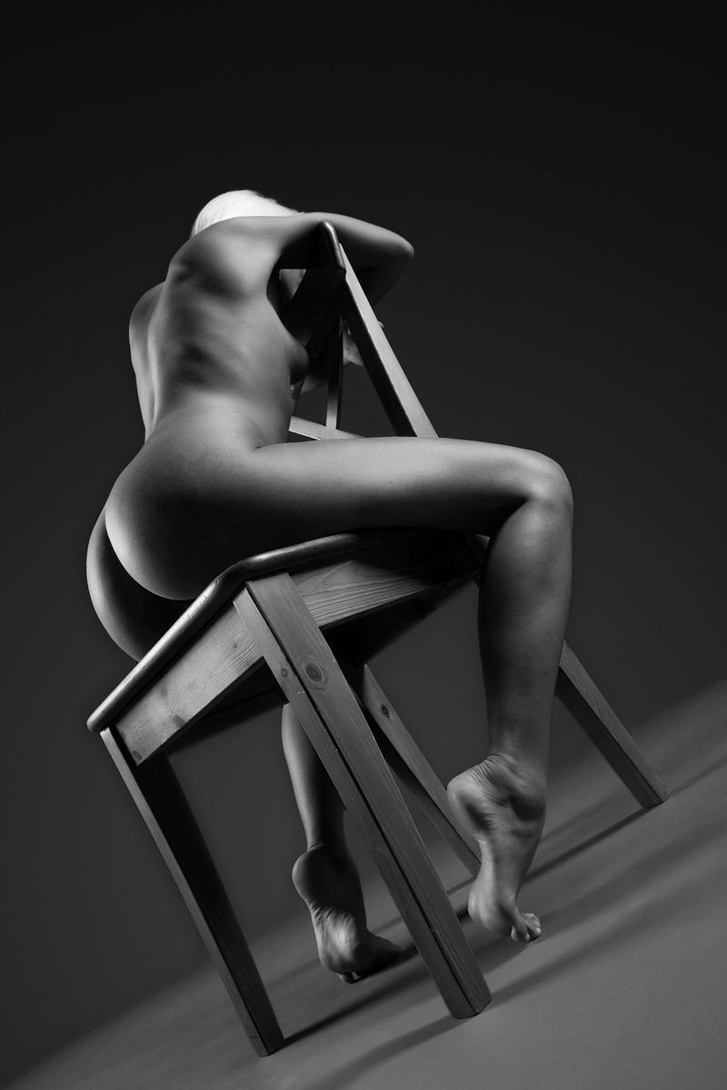 Erotic photo shoot on a chair
