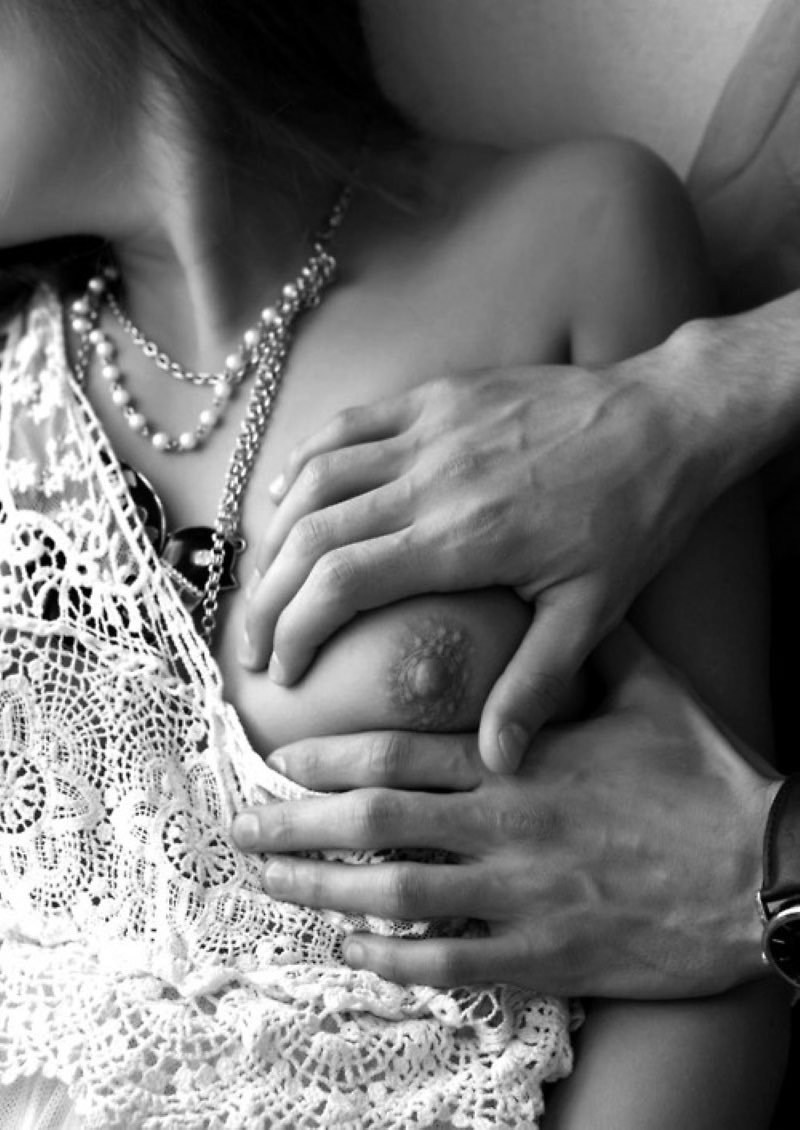 Male hand on a female chest