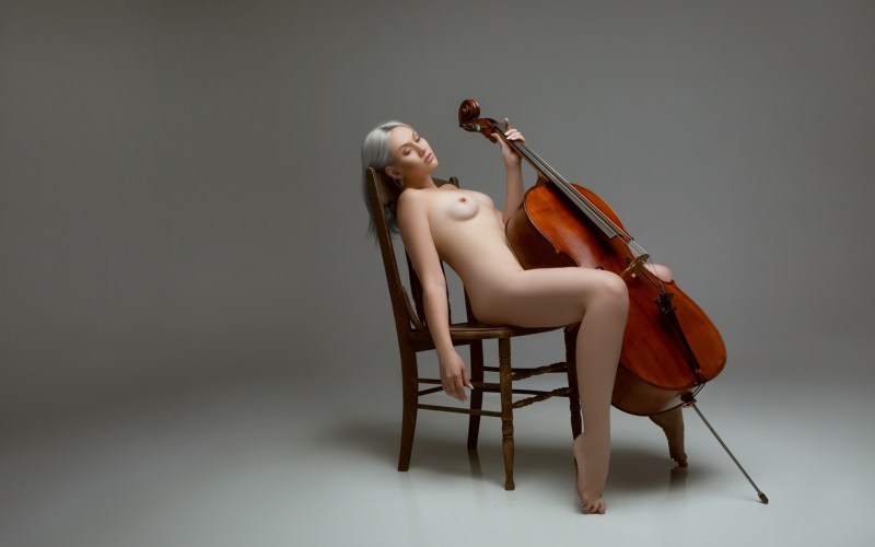 Naked women with musical instruments