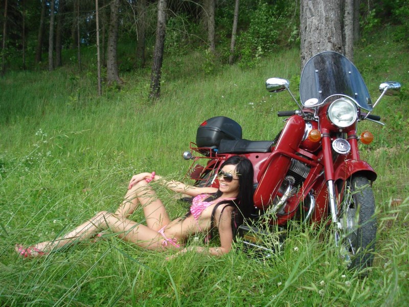 Parnukha in the forest on a motorcycle