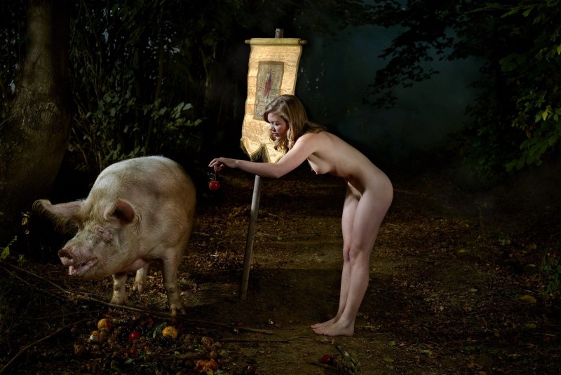 Naked women on a pig farm