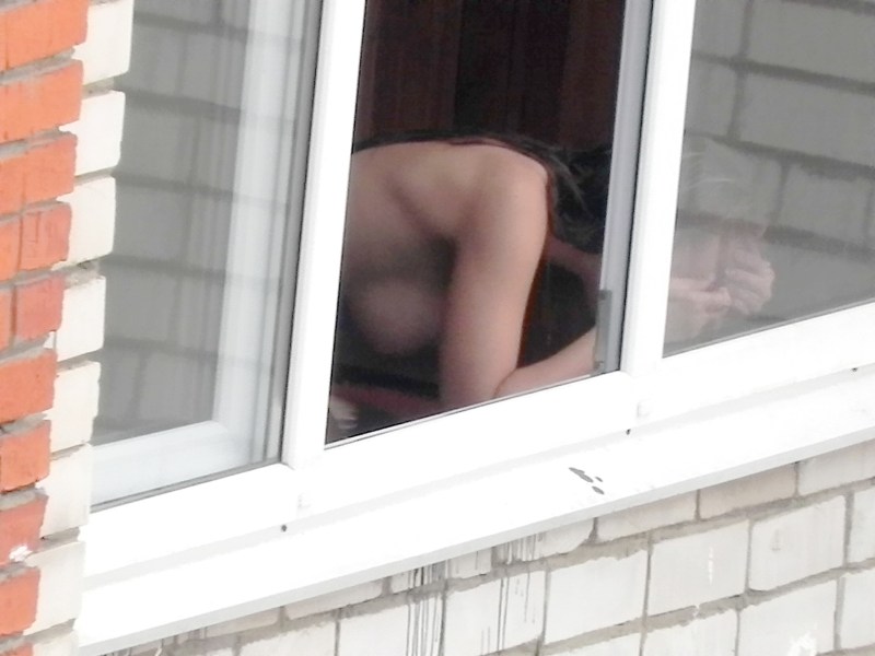 Naked woman through the window