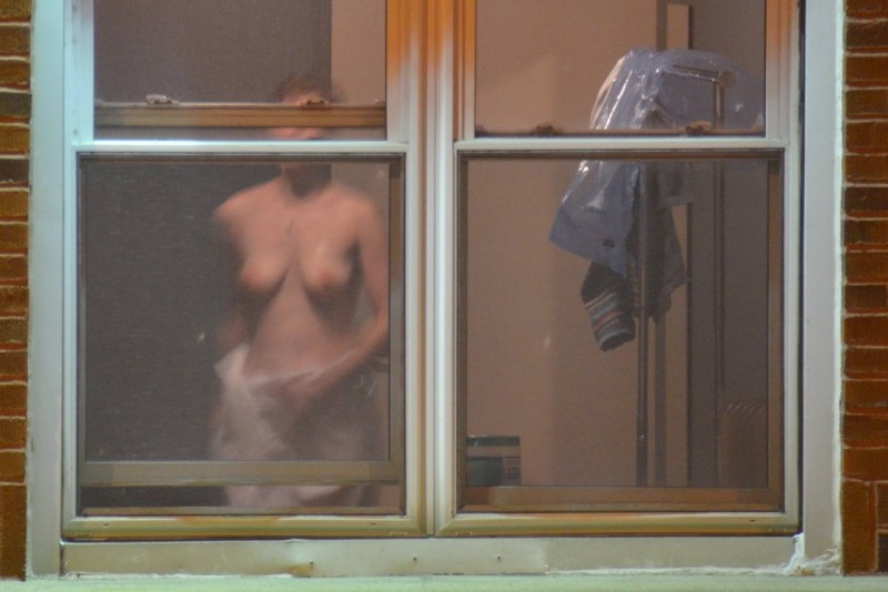 Naked woman through the window