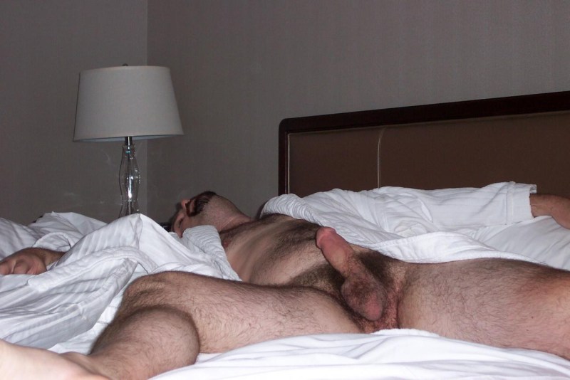 Hairy naked man sleeps