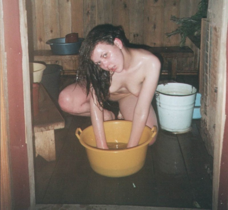 Naked girls wash in a bathhouse