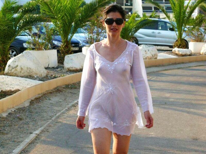 Mature woman in a transparent dress