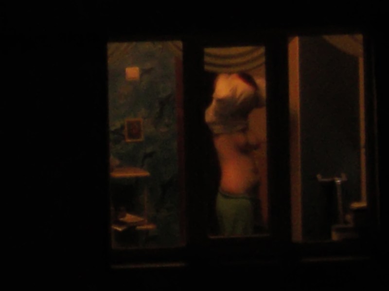 Window at the window at night