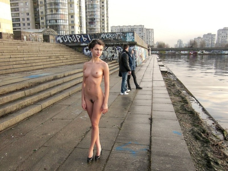 Naked woman on the embankment
