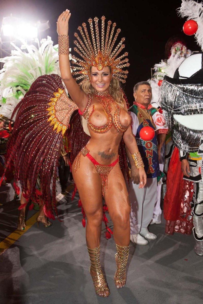 Naked women in carnival costumes