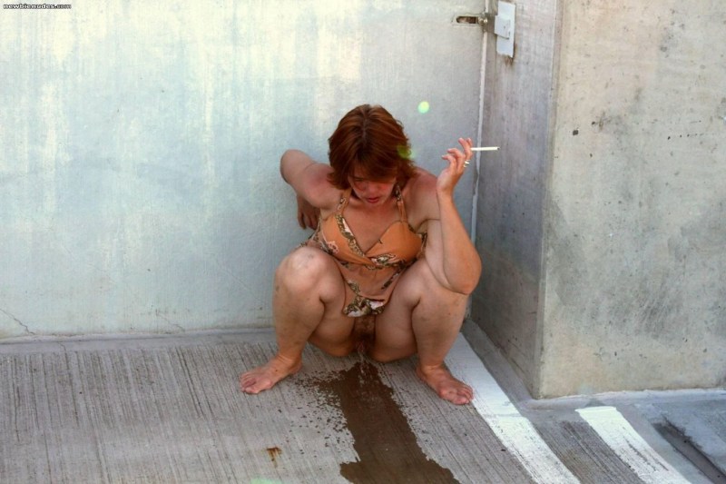 Naked women poop on the street
