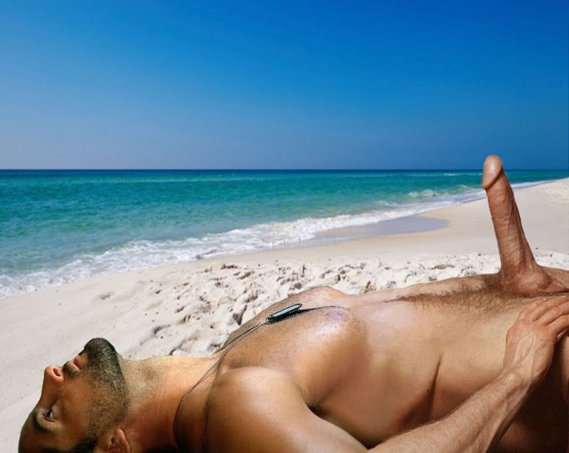 A naked man lies on the beach
