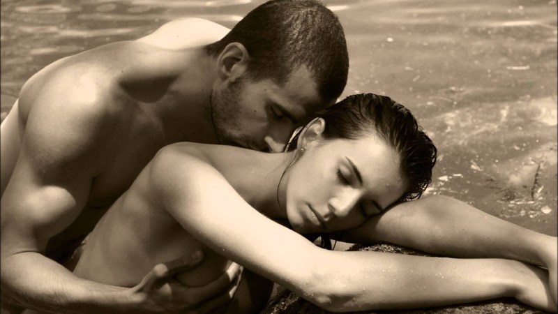 Naked man and woman in water