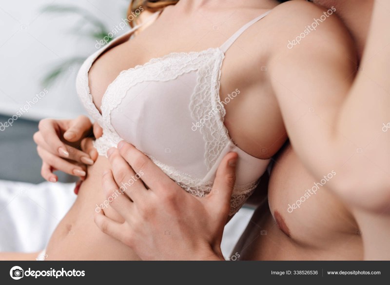 Bowing of boobs in a white bra