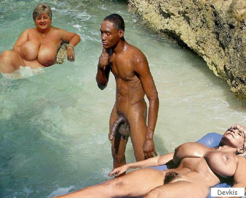 Naked nudist with a black man on the beach