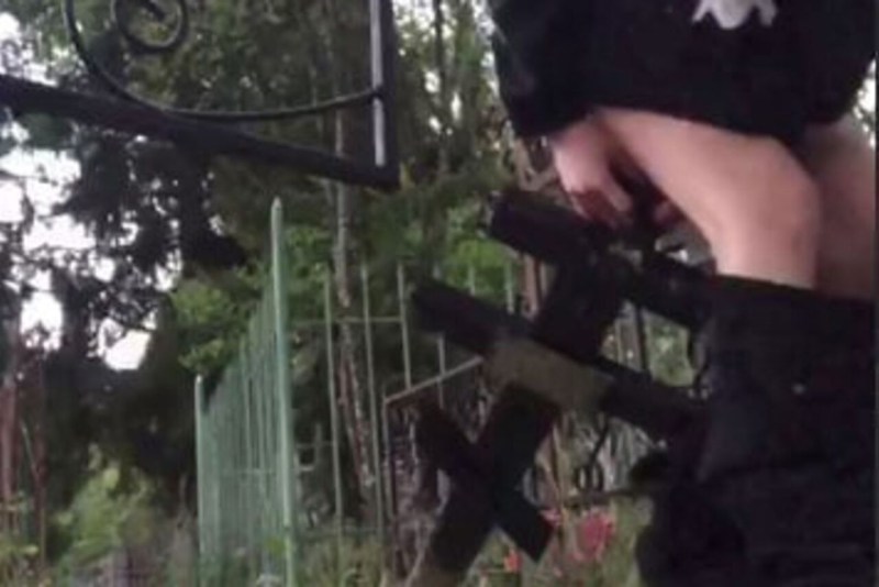 Girl in Samara sat on the grave cross