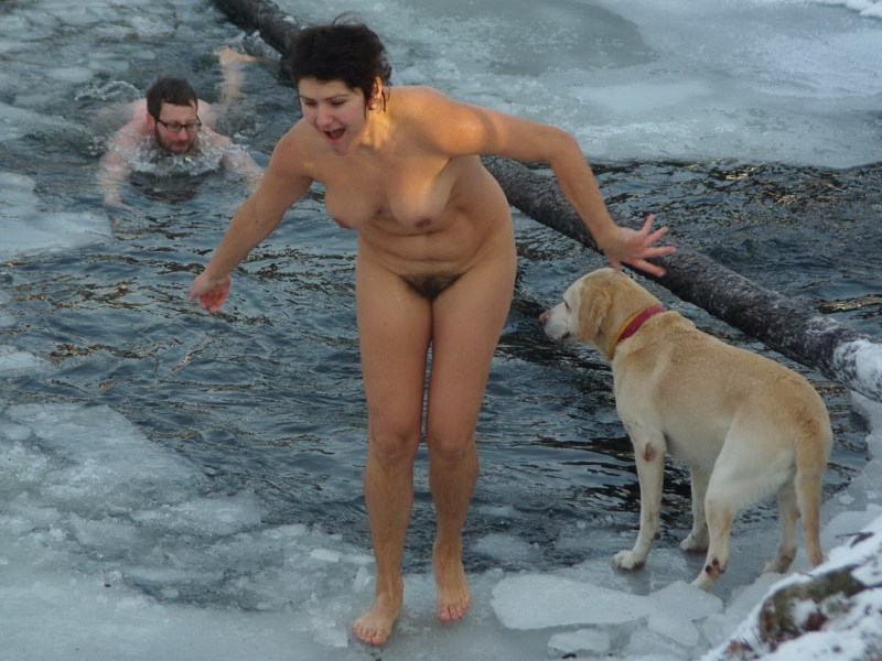 Naked walruses bathe in the hole