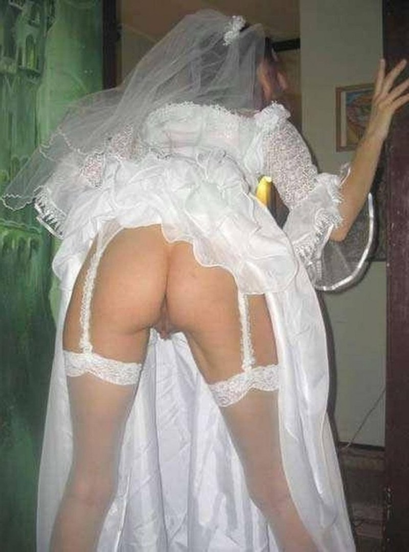 Peeping under the dress of the bride. 