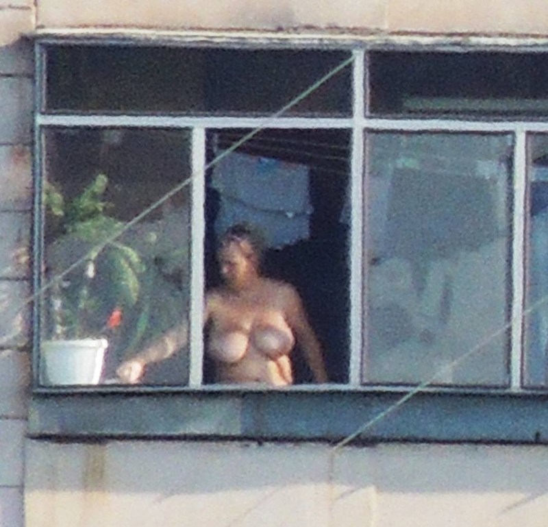 Neighboring windows naked women