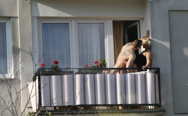 Sunbathing on the balcony naked