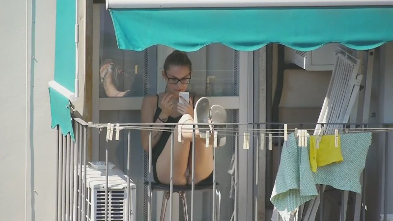Naked on the balcony spied