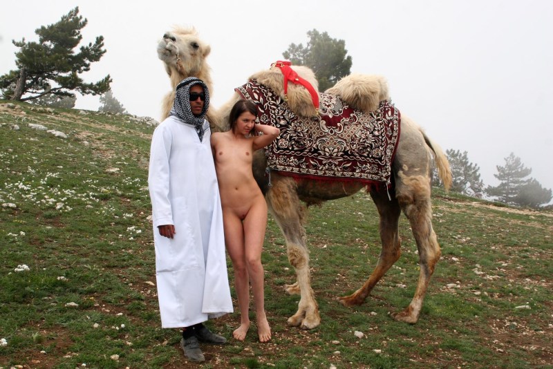 Naked photo shoot with a camel