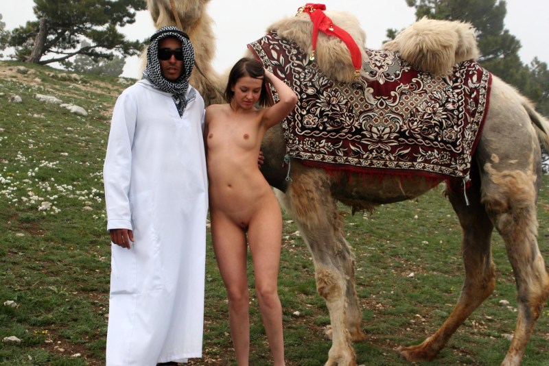 A girl without panties on a camel
