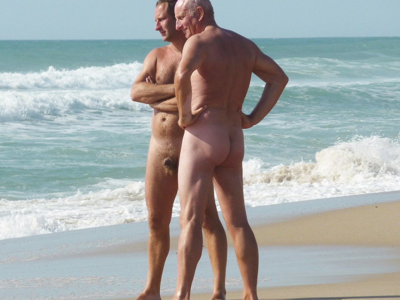 Naked men on a nudist beach